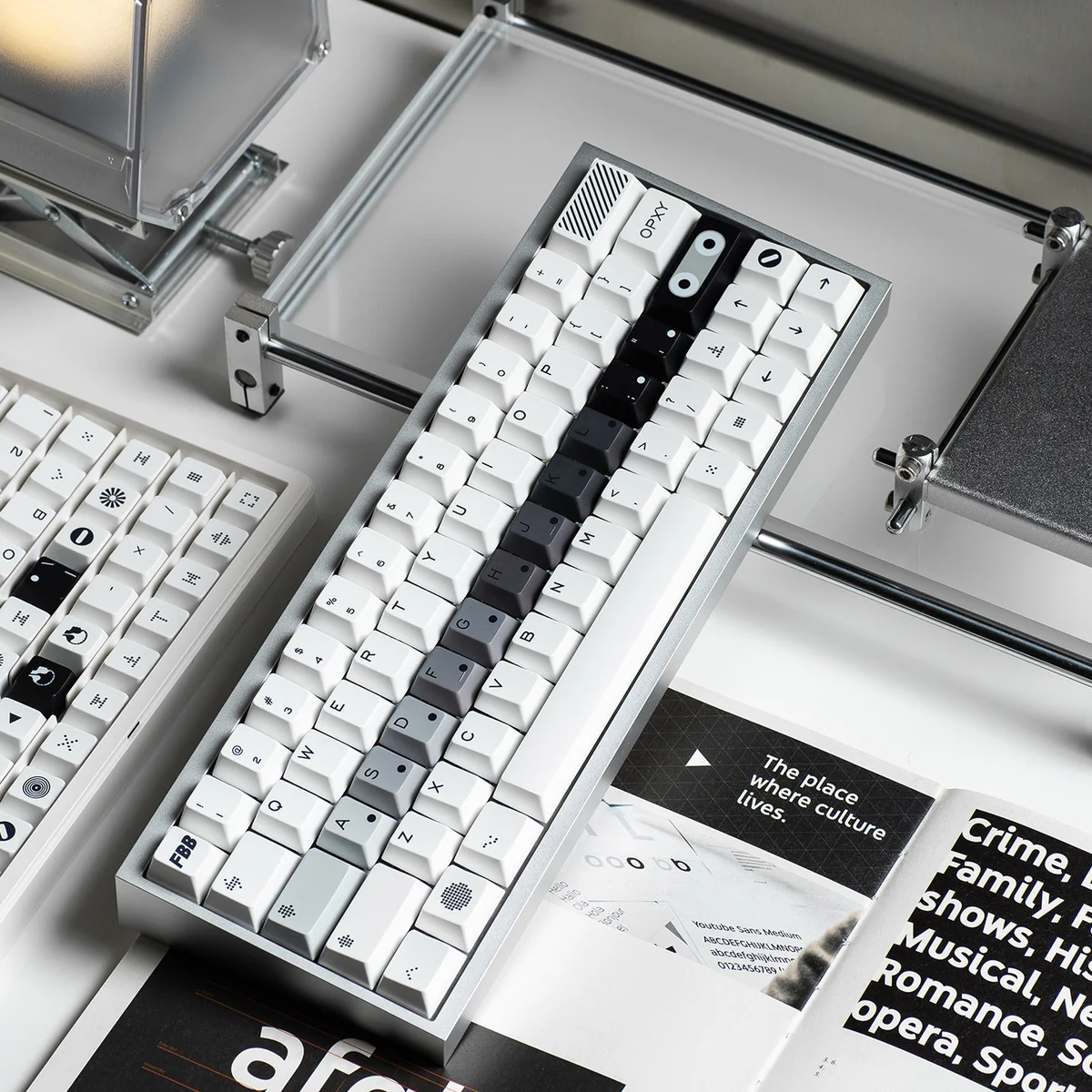Close-up of OPXY White Cherry Keycap Set showcasing the sophisticated monochromatic blend and fluid transition, highlighting the striking design.