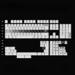 Detailed view of the striking OPXY White Cherry Keycap Set, highlighting its modern, artistic monochromatic fluidity.