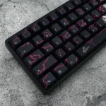 A dynamic close-up of the Urban Graffiti PBT Keycaps Set, revealing the durable black PBT construction and unique, vibrant street art designs from multiple angle.