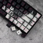 Close-up of Urban Graffiti PBT Keycaps Set, revealing intricate street art patterns and durable PBT material from an artistic side angle, enhancing customization setup.