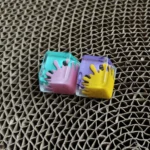 Vibrant handcrafted graffiti resin ESC keycap featuring dynamic splatter art in bold, contrasting colors, perfect for custom mechanical keyboards.
