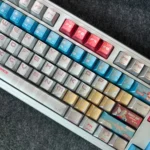Detailed shot of the iconic RX-78-2 Gundam keycaps set, showcasing their premium metallic finish from a striking angle. This set embodies the legendary design.