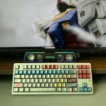A close-up view of the iconic RX-78-2 Gundam keycaps set, showcasing their premium metallic finish and detailed mecha aesthetic.