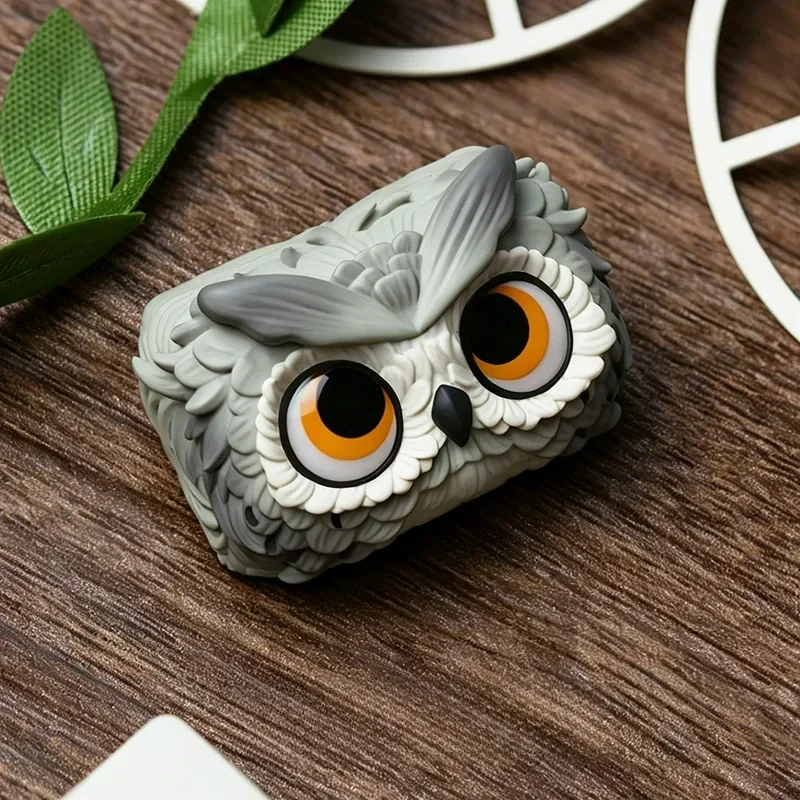 Close-up of the handcrafted resin owl artisan keycap, showcasing its enchanting forest design and unique artistic details from a captivating side preview.