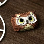 Unique handcrafted resin owl artisan keycap for keyboards, with an intricate enchanting forest design. Meticulously crafted, it brings nature's mystical setup.