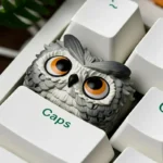 Handcrafted resin owl artisan keycap, showcasing its unique intricate forest design from a side view, adding mystic charm to mechanical keyboards.