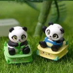 A close-up of the handcrafted resin panda keycap, highlighting its adorable, intricately detailed form and whimsical charm from a unique perspective,