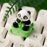 Handcrafted resin panda keycap from a unique angle, showcasing its adorable, intricately detailed design and whimsical pose, an artistic ESC charm.
