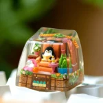 Whimsical handcrafted resin penguin keycap, an artisan ESC key showcasing a charming penguin with vibrant arctic colors and glossy finish.