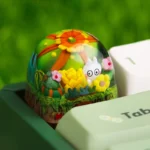 Handcrafted epoxy resin succulent keycap for ESC, showcasing the vibrant miniature plant beautifully encased in clear resin, captured from an artistic design.