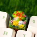 Close-up of a vibrant, handcrafted epoxy resin succulent keycap, showcasing its intricate miniature plant detail within clear resin, perfect for ESC Key.