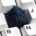 Explore the intricate details of the handcrafted Lovecraftian Cthulhu keycap from multiple angles, revealing its dark resin artistry and cosmic horror design.