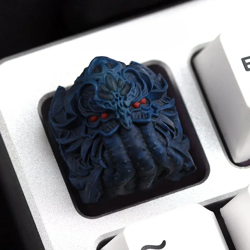 A close-up side view of the Cosmic Dread Cthulhu artisan keycap, revealing its handcrafted resin texture and dark, intricate Lovecraftian horror design.