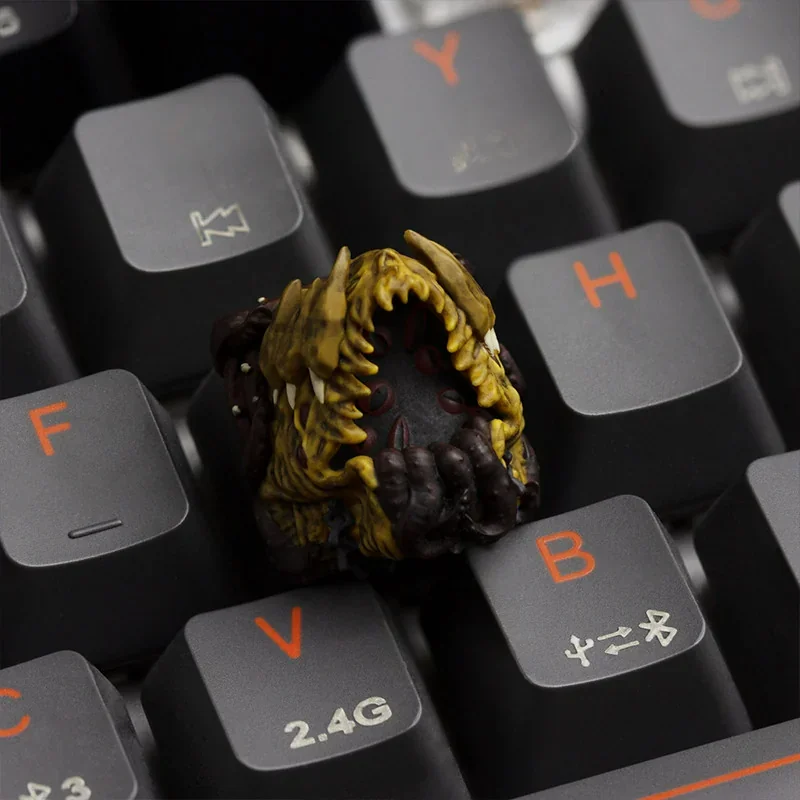 Close-up of a handcrafted resin Cosmic Dread Cthulhu ESC keycap from multiple angles, showcasing its intricate, dark Lovecraftian horror details.