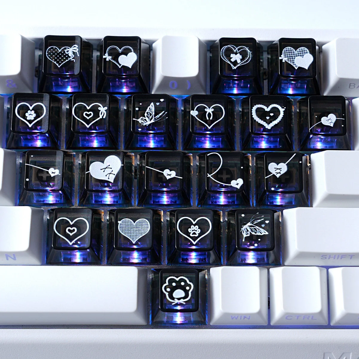 An artistic gallery of romantic heart butterfly Supplement Keycap Set, showcasing their delicate translucent design, shimmering motifs, and vibrant backlight glow.