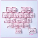 Artistic translucent pink heart butterfly Supplement Keycap Set (21-key set) shimmering with backlight, enhancing a romantic PC setup.