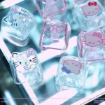 Close-up of the Hello Kitty Glitter PC keycap set, showcasing sparkling transparent keycaps with adorable Hello Kitty designs from a playful angle.