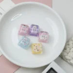 Exclusive Hello Kitty Star Bottle artisan resin ESC keycap showcased from multiple playful angles, featuring dreamy pastel colors and sparkling details.
