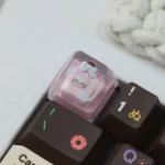 Close-up of the exclusive Hello Kitty Star Bottle artisan resin ESC keycap, showcasing its dreamy pastel hues and sparkling Hello Kitty inside a star motifs.