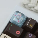 Close-up of an exclusive Hello Kitty Star Bottle artisan resin ESC keycap, showcasing its dreamy pastel colors and sparkling details from a playful angle.