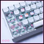 Playful Hello Kitty translucent PC Supplement Keycap set, showcasing their iconic design and glowing pink-clear hues from various whimsical angles.