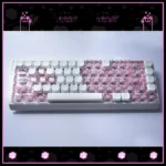 Playful Hello Kitty translucent PC Supplement Keycap Set, glowing pink and clear, showcased from multiple angles, highlighting its iconic, whimsical design.