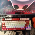 Exclusive Hollow Knight 'The Knight' PBT keycap Set, displaying its soulful Cherry profile and minimalist dark fantasy art from various angles.