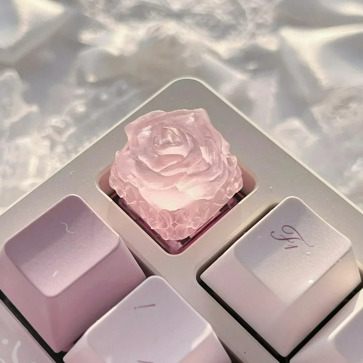 Ethereal Ice Rose Translucent Keycap, showcasing its frosted glow and delicate ice rose design from a unique angle, capturing its mystical garden aesthetics.