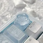 Close-up with Ice Rose Translucent Keycap, showcasing its frosted glow and delicate ice rose design from a unique angle, capturing its mystical garden aesthetics.