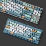 Durable Inception PBT keycaps set display. Intricate dreamscape architecture evokes surreal cityscapes and artistic depth for a unique keyboard.