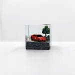 Captivating close-up of the Initial D AE86 drifting artisan JDM resin keycap, revealing intricate details of the miniature car mid-drift from a dynamic design.