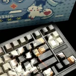 Premium Itachi Uchiha PBT Dye-Sub keycap set for Naruto fans, showcasing multiple keycaps from various angles with iconic dark aesthetics.