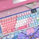 Angled view of the exclusive Needy Girl Overdose KAngel keycap set, displaying its vibrant internet-core artwork and playful digital charm.