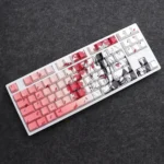Mystical Kitsune PBT keycaps, highlighting the vibrant gradient pink fox mask, striking red eyes, and unique side-lit features.