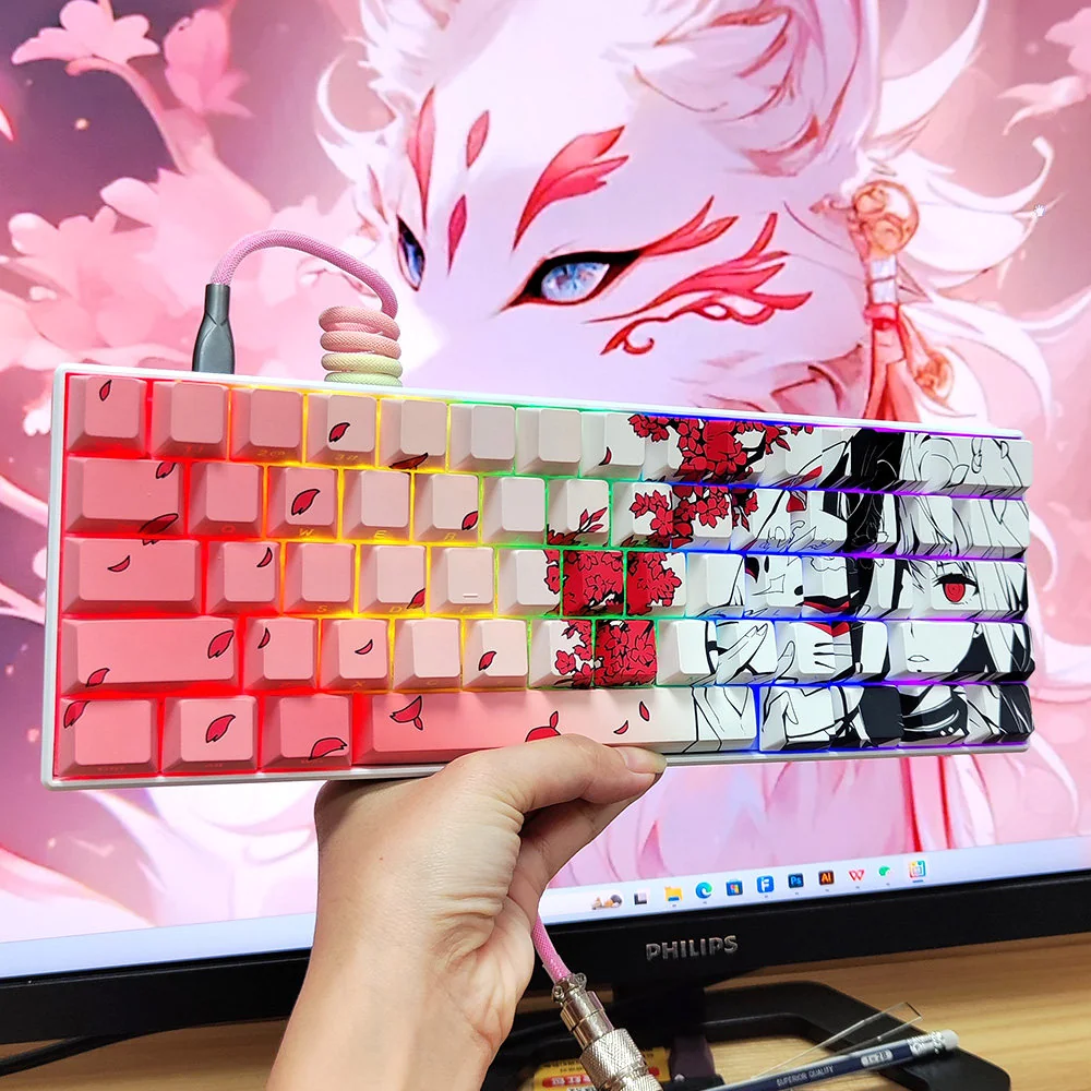 Mystical Kitsune Keycaps, a side-lit PBT set showcasing a vibrant gradient pink Japanese fox mask with striking red eyes for an artistic keyboard.
