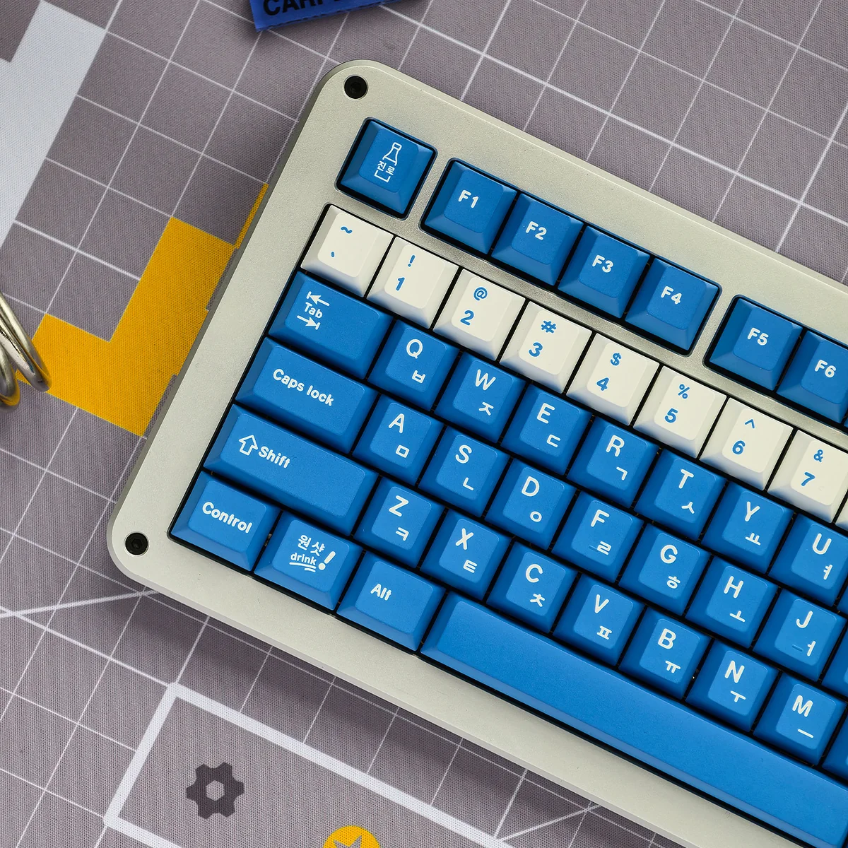 Close-up of a unique Soju Korean PBT keycap set, highlighting vibrant designs with intricate Korean legends, enhancing a nostalgic desk.