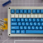 Vibrant Soju Korean PBT keycap set, artfully arranged, showcasing unique Korean legends for a nostalgic desk aesthetic.