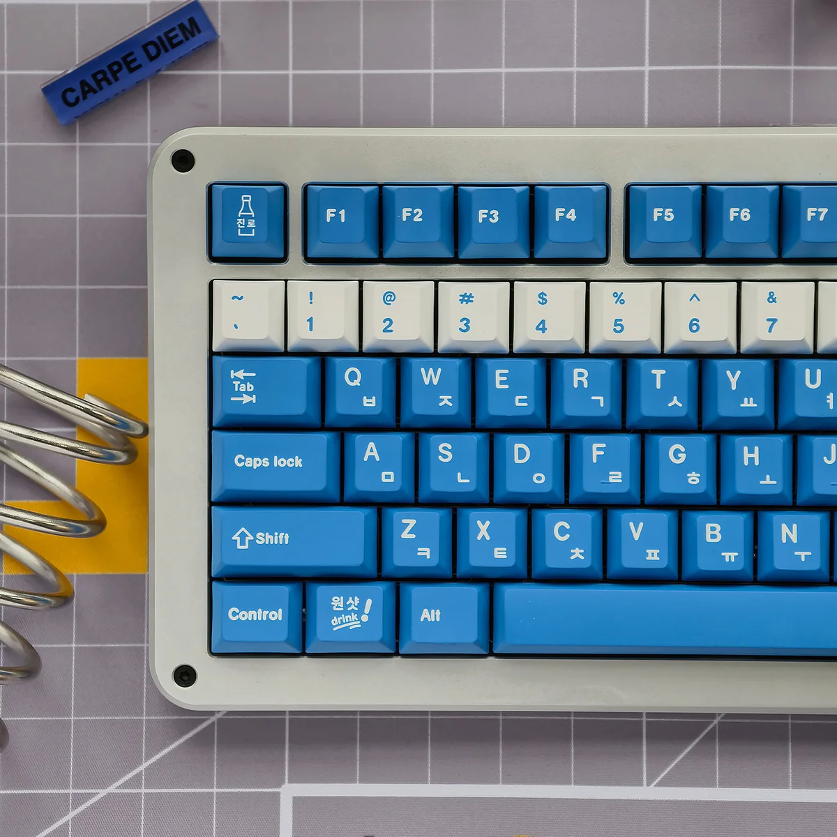 Vibrant Soju Korean PBT keycap set, artfully arranged, showcasing unique Korean legends for a nostalgic desk aesthetic.