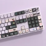Mischievous Kuromi PBT keycap set displayed in detail, showcasing vibrant characters. These premium PBT keycaps offer a playful upgrade design.