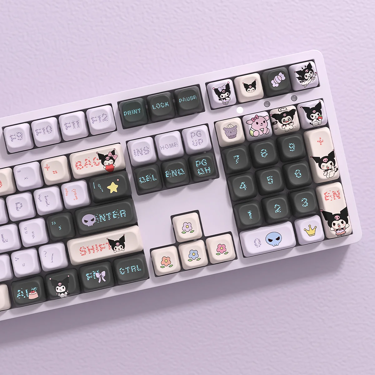 Mischievous Kuromi PBT keycap set displayed in detail, showcasing vibrant characters. These premium PBT keycaps offer a playful upgrade design.