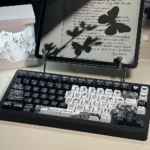 Exquisite lace-themed PBT dye-sub keycap set displayed from multiple angles, revealing intricate, delicate patterns and vintage elegance.