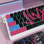 Close-up of vibrant Jinx League of Legends PBT dye-sub keycaps set, showcasing explosive chaotic art and bold colors from a unique angle.