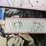 Line Art Keycaps Set: Side-Engraved Shine-Through TKL set shown in a gallery. Minimalist translucent keycaps glow subtly, revealing artistic designs.
