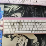 Close-up of minimalist line art side-engraved shine-through keycaps set, showcasing different angles of the translucent design and subtle glow. This unique anime art.
