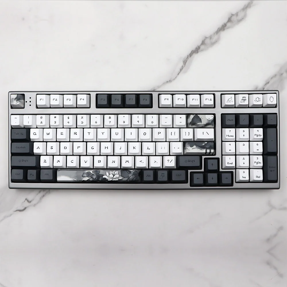 Serene Lotus PBT Dye-sub Keycap Set, showcasing tranquil PBT keycaps with elegant, subtle lotus flower designs. Artistic keyboard upgrade.