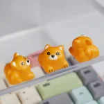A charming and detailed 3D Shiba Inu artisan keycap, handcrafted from vibrant resin, showing its adorable expressive face from a playful front view.