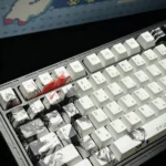 Close-up of vibrant One Piece Luffy PBT keycaps set, revealing detailed anime character art and adventurous themes for an epic typing adventure.