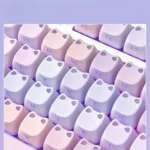 Detailed side view of the whimsical luminous cat PBT keycap set, highlighting the unique water lily pond design and the playful cat figure glowing.