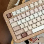 Caramel Maillard PBT dye-sub keycap set, a close-up revealing rich caramel and earthy tones. Durable Cherry profile for premium typing.
