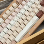 Caramel Maillard PBT dye-sub keycap set, durable and premium, shown from a unique angle. Highlights rich caramel and creamy tones.